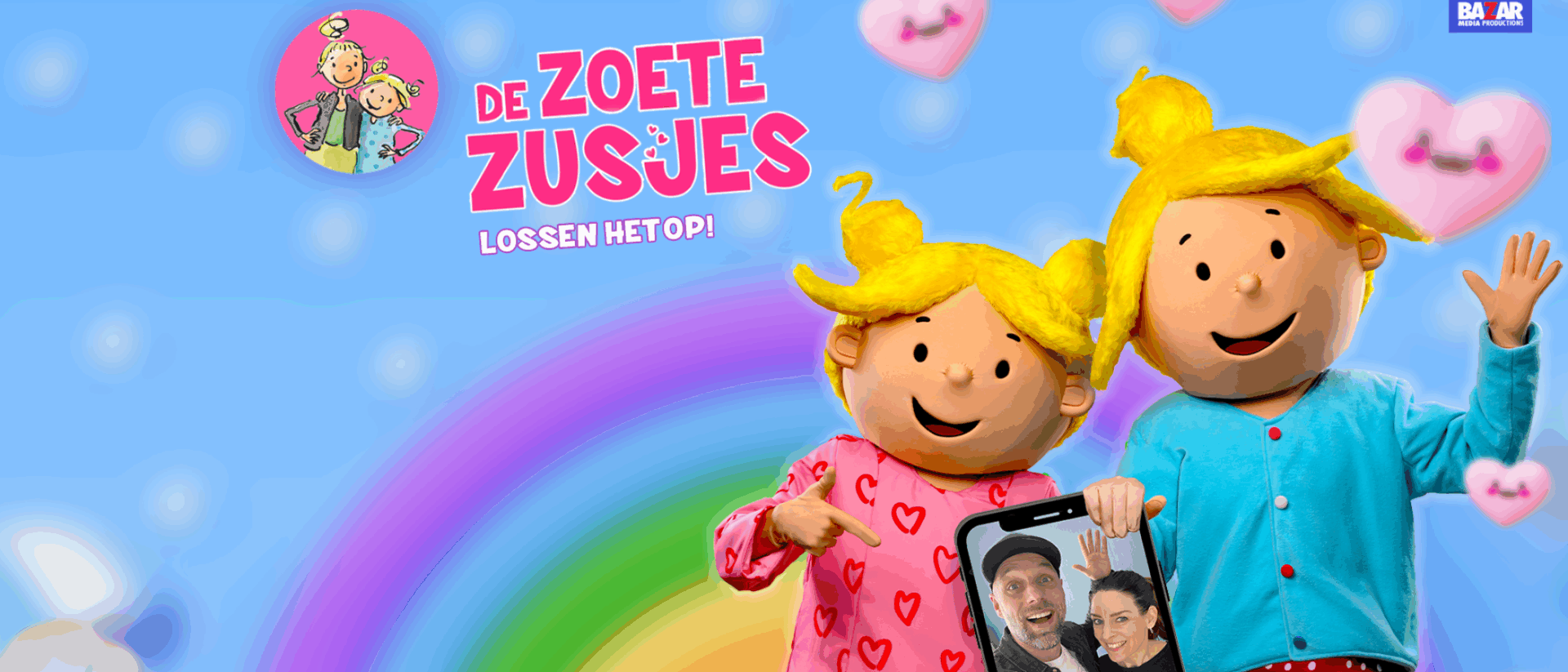 Afbeelding van de poppen van De Zoete Zusjes gedecoreerd met regenboog en telefoon met ouders erop.