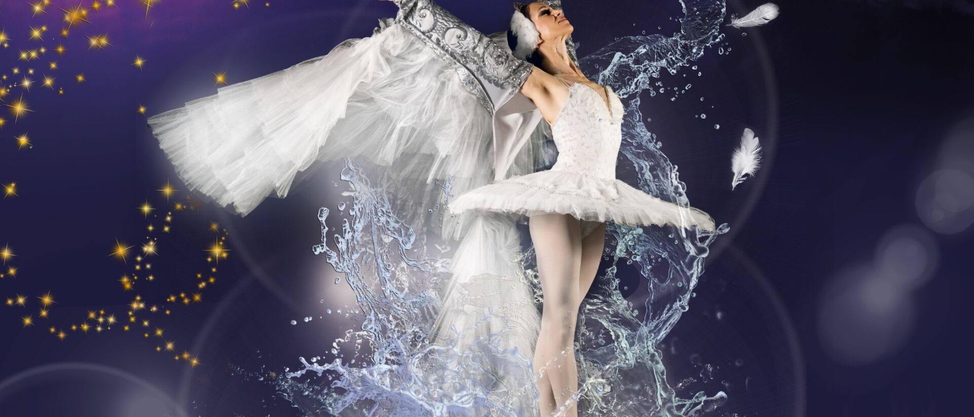 Een ballerina die met gestrekte armen naar boven kijkt. Met eromheen water spetters en vleugels aan haar armen.